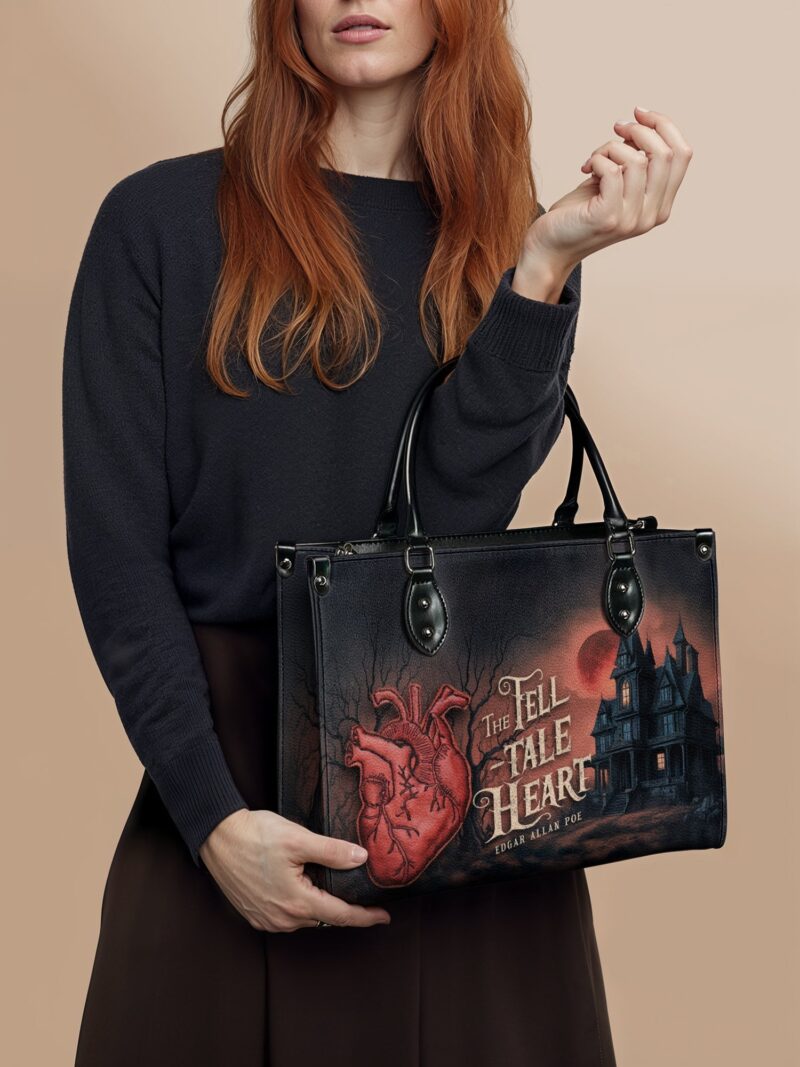 The-Tell-Tale-Hear-inuse-1_91ddad31-d406-4674-8956-3e68d3664c2e.jpg The Tell-Tale Heart Leather Handbag, Red Interior